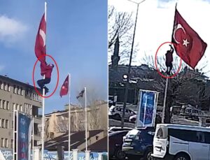 Rüzgarda dolanan bayrağı düzeltmek için 15 metrelik direğe tırmandı