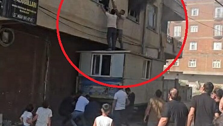 Yangında mahsur kalan kadını konteynerin üzerine çıkarak kurtardılar